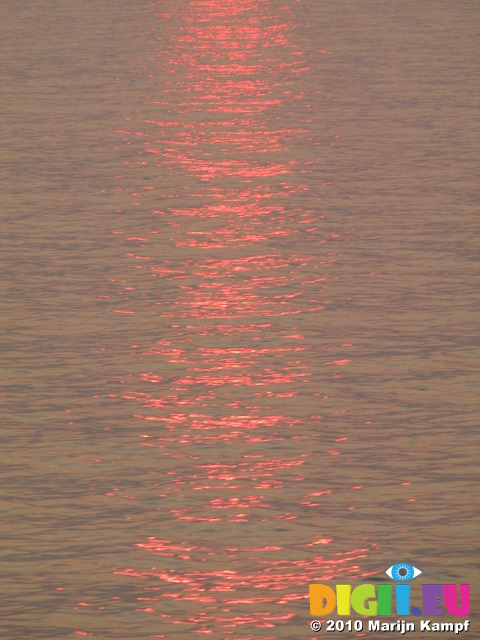 SX14860 Reflection of sunrise in channel water
